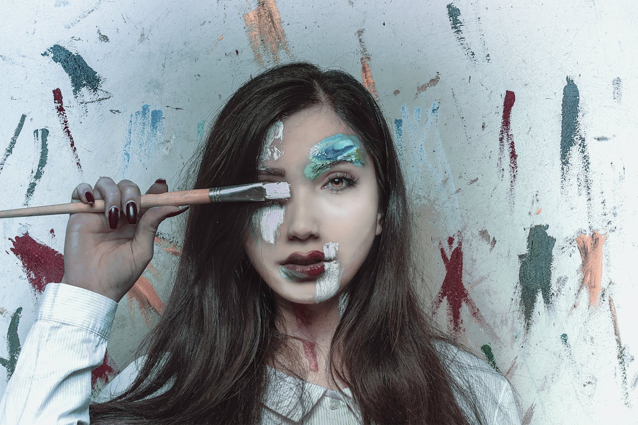 digital Vibrant portrait showcasing a woman with creative face paint and brush, embodying artistic expression.